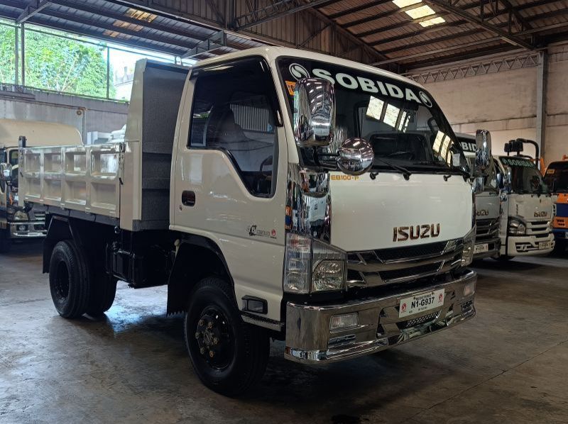 Used Isuzu elf surplus recontidioned dropside  dump truck nkr  n-series 300 series canter tornado  for sale in Manila, Philippines
