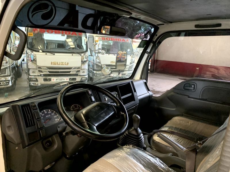 2023 Isuzu elf nkr reconditioned surplus drop side truck n-series  canter 300 series tornado pictures