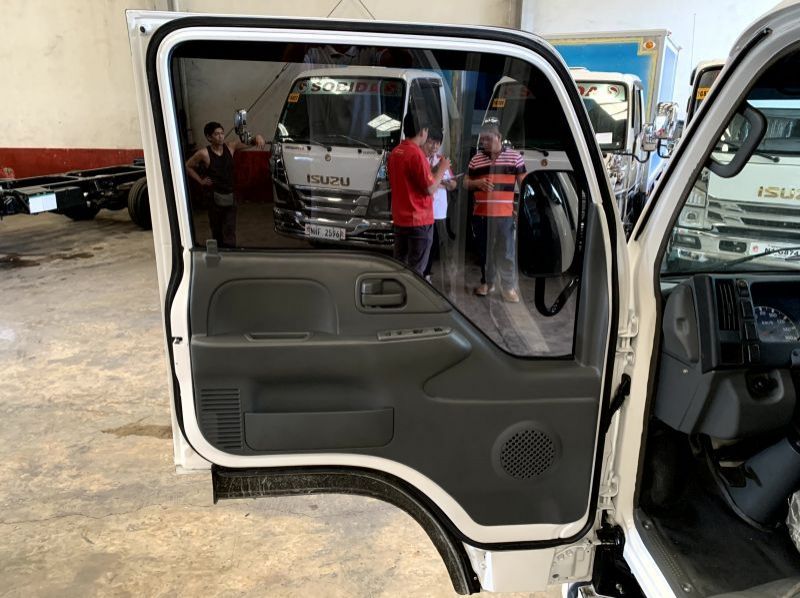 2023 Isuzu elf nkr reconditioned surplus drop side truck n-series  canter 300 series tornado pictures