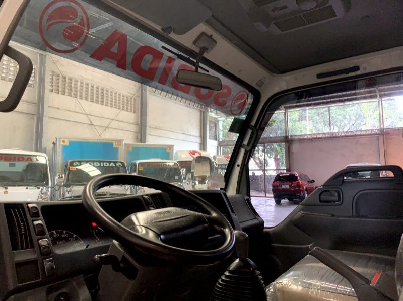 2023 Isuzu isuzu elf surplus drop side truck n-series canter 300 series tornado pictures